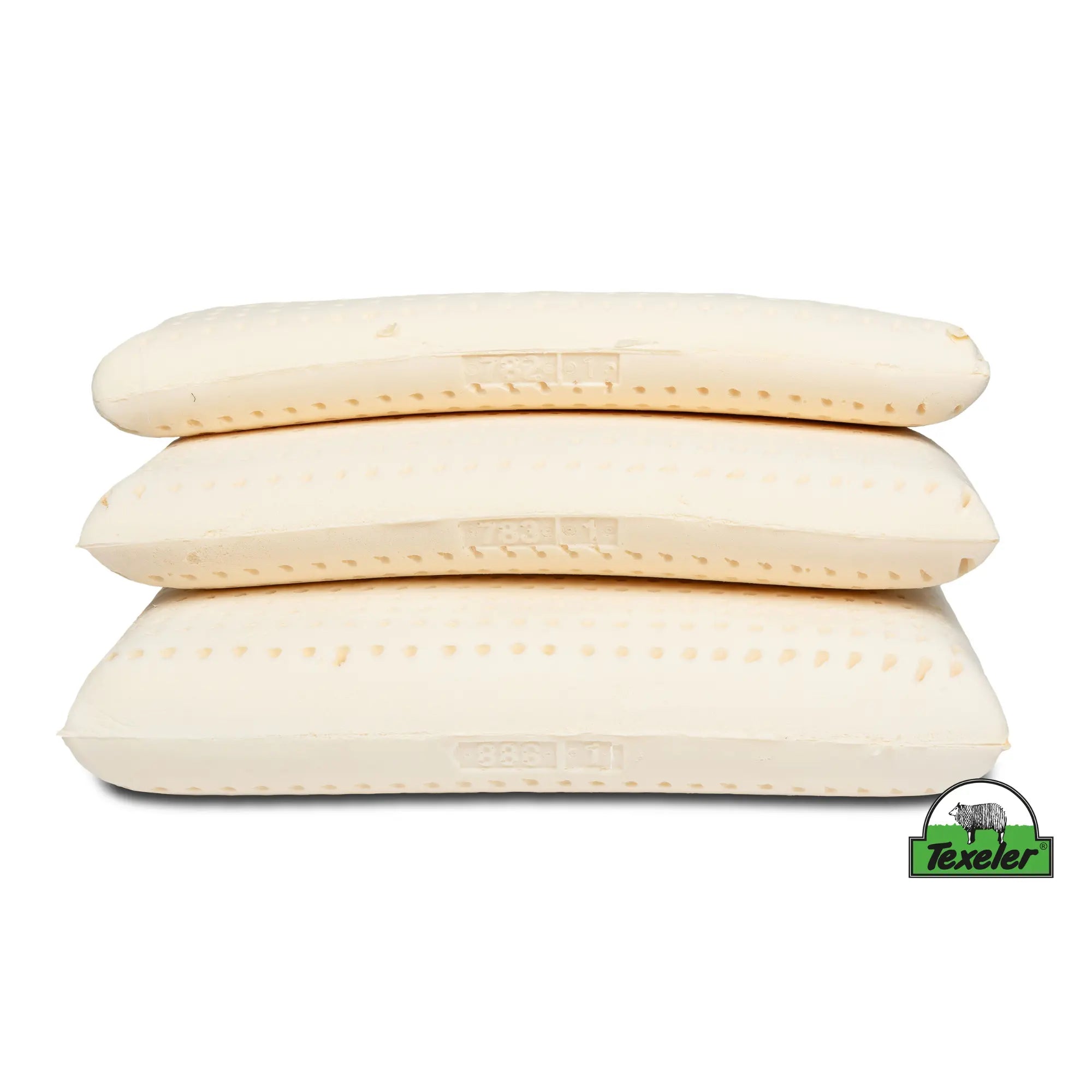 The latex cores in three different sizes stacked on top of each other with the smallest on top.product name texeler soezz supple wool pillow