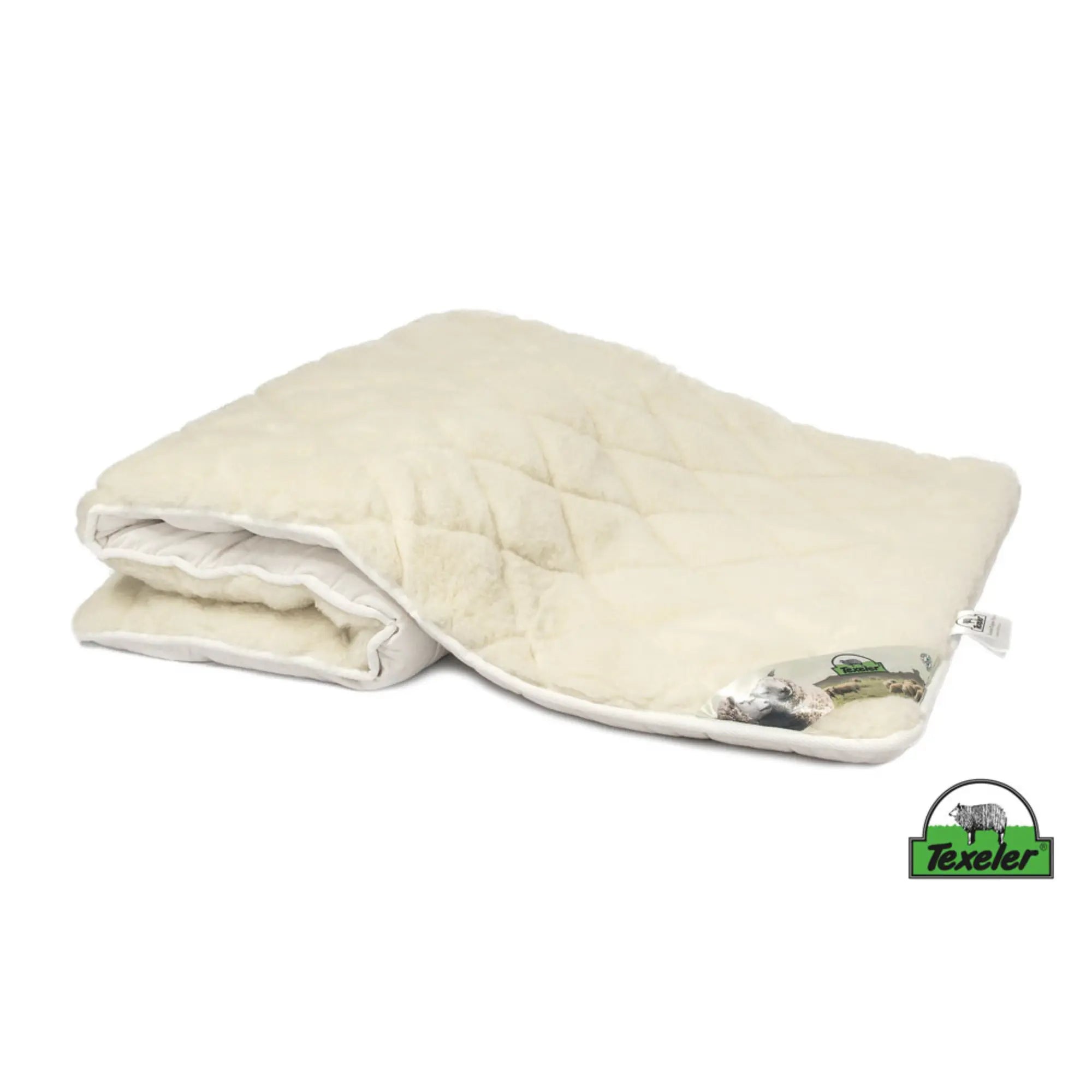 A beige mattress topper made of sheep wool with a wool and cashmere layer on top, placed on a white background, Laying half folded on the surface and the brand name texeler