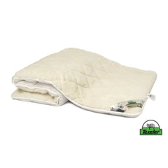 A beige mattress topper made of sheep wool with a wool and cashmere layer on top, placed on a white background, Laying half folded on the surface and the brand name texeler